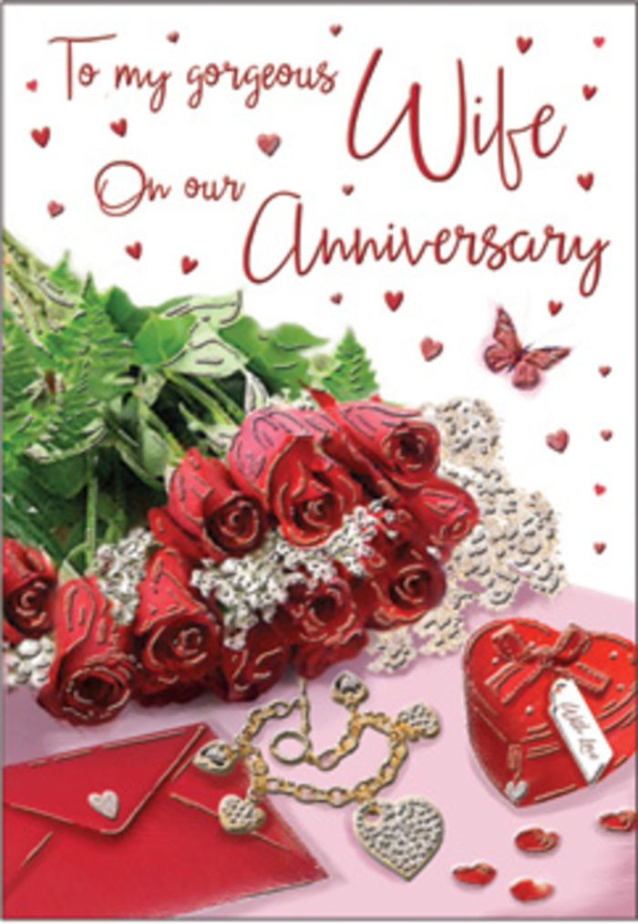 The image captures a richly detailed anniversary card arrangement, as if set on a polished table in a Grove Park home moments before it is discovered. A cluster of sumptuous red roses commands attention at the centre, their petals unfurling in velvety layers of deep crimson. Each bloom appears at its peak, with soft highlights skimming the edges of the petals, suggesting freshness and the gentle touch of daylight. Interlaced among the roses, sprigs of verdant foliage provide structure and contrast, their lively greens evoking the relaxed greenery around Grove Park's residential streets. Positioned beside the bouquet, an envelope lies partially in view, its light, matte paper forming a serene backdrop against which the roses' intensity truly sings. A heart-shaped box, polished and richly coloured, sits nearby, implying a hidden token of affection, while a delicate piece of jewellery introduces a subtle sparkle that catches the eye. Tiny red hearts are scattered artfully across the surface, their shapes echoing the theme of love, leading the gaze naturally toward the card's flowing message in elegant script. A single butterfly detail adds a whimsical touch, as though it has just fluttered down to rest among the keepsakes. The lighting is gentle and atmospheric, like late-morning sun filtering into a living room near the river, creating soft shadows that give depth and a sense of quiet intimacy. The composition feels thoughtfully curated yet warmly personal, reminiscent of an anniversary surprise prepared with care, where roses, heartfelt words, and symbolic gifts come together to celebrate years of shared memories and the promise of many more.