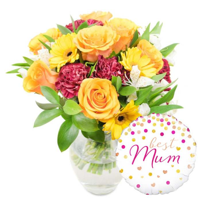 A richly hued bouquet occupies the foreground, arranged with the considered hand of a neighbourhood florist and photographed on a pure white backdrop to highlight every tone and texture. Prominent orange and golden-yellow roses form the principal focal masses, their layered petals soft and slightly lustrous under gentle lighting. Scattered among them, cheerful yellow gerbera daisies with dark centres read like bright punctuation marks, while clusters of deep red-burgundy carnations supply plush, ruffled density and temperament. White alstroemeria offers slender, speckled accents that lift the heavier blooms and introduce a delicate, floral whisper. The bouquet is surrounded by abundant green foliage-both broad, glossy leaves and delicate sprigs-that gives the arrangement a freshly gathered, garden-to-vase feeling. All stems are visible through a clear glass vase; the neat water line and trimmed stalks suggest careful conditioning and recent arranging. To the lower right, playfully overlapping the vase, a round white foil balloon is patterned with small gold and fuchsia dots and tiny heart shapes; the central message Best Mum is written in an elegant fuchsia script that leans slightly to the right, as if penned with affectionate haste. The overall impression is celebratory and intimate, suitable for Mother's Day, a birthday, or a simple act of thanks-perfect for delivery around Grove Park, along Baring Road, or to a cosy flat near Grove Park Nature Reserve where a mother's smile is the intended destination.
