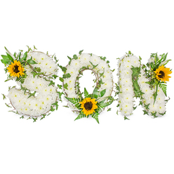 I describe this memorial piece as I would to a family choosing words in flowers: SON appears in three substantial capital letters, each letter meticulously laden with small, pristine white chrysanthemums that create a cushiony, velvety surface. The chrysanthemums read as soft ivory clouds; their clustered petals form a calm, tactile field that feels both protective and precious. Winding through the white beds, trailing ivy threads bring depth and a sense of living connection-dark, glossy leaves that catch the light and braid the letters together. A single large sunflower graces each letter: perched on the upper left curve of the S, settled low inside the O beside fresh fern fronds, and positioned at the upper right of the N. The sunflowers' warm yellow petals and textured brown centres act as beacons of warmth and remembrance against the dignified white. The photographer set the piece on a stark white background and used gentle, even lighting so the contrast between the chrysanthemum's soft cream and the greenery's varied greens is perfectly clear; shadow is minimal, detail maximal. The overall scent would be subtle-green, slightly herbaceous chrysanthemums with the honeyed note of sunflower pollen-conveying comfort rather than perfume. As a local florist aware of Grove Park's quiet streets and green pockets like the local nature reserve, I see this as the kind of tribute families choose for a graveside service or a funeral chapel: understated, handcrafted, and focused on memory, designed to be read from the front and felt in the heart.