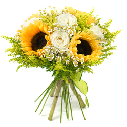 This hand-tied bouquet, photographed against a pure white background, offers a joyful study in sunny yellow, creamy white, and glowing green, as though it has been freshly gathered from an informal garden near Grove Park station. The eye is immediately drawn to the group of sunflowers at the centre, their wide, golden petals radiating out from deep, chocolate-brown centres that are slightly textured, suggesting the promise of seeds. These commanding blooms are softened by the presence of white roses nestled among them; some roses remain in neat, closed buds, while others open into lush spirals with smooth, velvety petals and gentle ivory shadings that catch the light. Dotted throughout are clusters of small, daisy-like white flowers, much like chamomile or feverfew, each with a bright yellow eye, which introduce an element of playfulness and fine detail, breaking up the larger shapes and giving the bouquet an almost meadow-like character. Surrounding and threading between all these blooms is an airy veil of lime-green foliage, similar to solidago, with tiny buds and feathery stems that add volume without heaviness. The overall form of the bouquet is rounded yet informal, suggesting the loving touch of an experienced local florist rather than something overly rigid. At the base, the natural green stems are aligned and tied securely with a lime-green ribbon that wraps smoothly around them and hangs slightly at the front. The mood conveyed is warm, uplifting, and generous, perfect for celebrating special occasions in Grove Park, welcoming someone to a new home, or simply brightening a grey London day with a burst of floral sunshine.