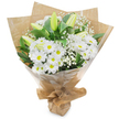 A classic, hand-gathered bouquet of white petals and deep green foliage stands upright against a clean white background, its composition quiet and assured. At the heart of the arrangement a generous cluster of white, daisy-like chrysanthemums radiates with hundreds of fine petals curling toward small sunny yellow centres; their round, cheerful faces lend an optimistic, timeless quality. Sprinkled through and around these are delicate clouds of baby's breath (Gypsophila), their tiny white blooms like soft, translucent mist that lifts the heavier shapes and creates breathy texture. Several elongated lily buds-pale green to lemon-cream in tone, some faintly striped-rise gently above the chrysanthemums, still tightly furled and promising a later, elegant unfurling. Glossy, dark green leaves and stems form a verdant backdrop that sharpens the bouquet's crisp white palette. The stems are hand-tied and wrapped in an inner sheet of natural, crinkled brown kraft paper that introduces an earthy, tactile contrast; an outer layer of clear, glossy cellophane protects and brightens the flowers, catching the studio light with a soft shimmer. The base is neatly gathered and secured with a simple twine knot that forms a portable stand, the kind of finish a neighbourhood florist would use to keep blooms safe on a short journey. The scent is understated and fresh-green, slightly grassy with a faint powder of floral sweetness-and the overall effect reads as purity and calm: suitable for a new beginning, a gentle thank-you, a sympathetic note, or a serene table accent. This bouquet feels like the kind of thoughtful offering you might pick up from a local Grove Park stall on a quiet morning, chosen for its simple beauty and soothing presence.