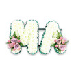 The photograph shows an immaculate funeral flower tribute spelling out the word MA, a simple yet deeply emotional arrangement ideal for honouring a beloved mother or mama. The letters are constructed from a sturdy base and completely covered with compact white chrysanthemums, arranged so closely that their petals form an even, downy surface. The white blooms radiate calm and purity, offering a quiet presence much like the tranquil green spaces around Grove Park. Around the outer edge of both the M and the A runs a narrow band of dark green ribbon, carefully ruffled to create a soft, pleated frame. This rich green outline adds contrast, clearly defining the letter shapes and giving the tribute a professional, finished look often associated with experienced local florists such as Grove Park Florist. At the base of the left stroke of the M and the right stroke of the A, small yet striking floral sprays soften the design. Each features a harmonious blend of blush-pink roses, lilac-hued roses, and tiny pink spray roses, some just beginning to open. These pastel flowers are threaded with delicate fern fronds and small leaves of greenery, which introduce light, feathery textures and a touch of natural movement. The image is shot against a stark white background, highlighting the contrast between the crisp white chrysanthemums and the subtle pastel roses. This MA letter tribute is the kind of arrangement that might be placed gently at the front of a funeral or memorial service in Grove Park, beside a framed photograph or keepsake, offering a floral whisper of love, thanks, and lifelong remembrance from family and friends.