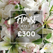 A close-up, richly detailed image captures the luxurious Florist Choice Bouquet, priced at ?300, set to charm anyone in Grove Park and beyond. The arrangement presents an abundant display of fresh, premium flowers, dominated by white roses in multiple stages of bloom, their velvety petals softly curling. Nestled among them are white lilies, their broad petals gleaming with a satin sheen and inner petals touched with a gentle pink flush that catches the light. Subtle accents appear as smaller pink blossoms, like delicate confetti within the halo of white, while clusters of green foliage-eucalyptus-like leaves-provide cool, aromatic contrast and depth, giving the bouquet a natural, garden-fresh feel.
The frame is filled with lush blossoms, yet the composition remains elegant and balanced. A crisp white rectangular overlay sits across the centre, bordered by a fine line, bearing the words Florist in a flowing script, followed by CHOICE BOUQUET in uppercase sans-serif, and the price ?300 in bold white numerals. This overlay reads as a badge of specialty, a promise of careful selection and expert arrangement. The overall mood is one of refined opulence, suitable for a thoughtful gift or a celebration that calls for quiet grandeur. In Grove Park, this bouquet is a favorite for birthdays, anniversaries, or to convey sympathy with grace, and it can be delivered with care to nearby streets, parks, and homes. The scent of fresh blooms and the cool, clean line of the white typography together create a moment of serene luxury in a busy day.