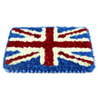A carefully crafted Union Jack floral tribute is displayed in this image, shaped as a substantial rectangle and set against a clean white background so every colour stands out. The flag is constructed from hundreds of small-headed blooms, mostly tight chrysanthemums and velvety carnations, pressed closely together to form a dense, velour-like surface that appears both soft and refined. A deep expanse of dark blue flowers forms the background field, their uniform shade suggesting calm and stillness, like the quiet atmosphere of Grove Park's residential streets on an early morning. Over this blue base, neat bands of pure white flowers define the vertical and horizontal arms of St George's Cross, meeting at the centre in a perfectly balanced intersection. Diagonal stripes of bright red carnations trace St Patrick's Cross, each stripe edged with a slim line of white blooms, ensuring that the iconic Union Jack pattern remains clean and easily recognisable. The overall shape has a gentle curvature, subtly higher in the centre and tapering down to the edges, which gives the arrangement a sculpted, cushion-like effect that feels particularly appropriate for a tribute resting on a coffin or memorial stand. Along the bottom edge, a pleated royal blue satin-style ribbon forms a polished border, echoing the deep tones of the background flowers and lending an air of ceremony. Crafted with the care of a local Grove Park florist, this floral flag is well suited to military funerals, remembrance services, or any farewell that seeks to honour a life intertwined with British heritage, offering a blend of patriotism, tenderness, and quiet respect.