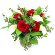 A refined bouquet of richly coloured red roses and pristine white calla lilies stands in a clear glass vase, captured against a crisp white background that lets its elegance speak without distraction. At the heart of the design, six to seven fully opened roses in deep crimson form a lush cluster, their velvety petals spiralling inward with a softness you can almost feel, bringing to mind romantic evenings in the quieter corners of Grove Park. Rising between these roses, four to five calla lilies introduce an architectural grace, each flower a smooth, trumpet-shaped curve of creamy white petals wrapped around a delicate golden spadix. The lilies' sleek, modern lines contrast beautifully with the more traditional fullness of the roses, creating a bouquet that feels both timeless and contemporary. Around the blooms, a generous border of greenery adds movement and texture: fine eucalyptus stems with small, rounded, silvery-green leaves lend a gentle, airy quality, while larger, glossy dark green leaves provide structure and depth, reminiscent of the mature trees that line the roads towards Chiswick and the Thames. The cylindrical glass vase is unadorned apart from a subtle ribbed detail at its base, and its transparency reveals the neat arrangement of green stems resting in clear water, reinforcing the sense of freshness that comes from flowers prepared close to home. Bright, even lighting bathes the bouquet, highlighting the satin sheen of the calla lilies, the velvety richness of the roses, and the varied greens of the foliage, while casting only soft, understated shadows. The overall impression is one of quiet luxury and heartfelt emotion, suitable for anniversary surprises, romantic gestures, or a sophisticated centerpiece delivered to any address around Grove Park.