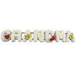 The photograph shows a detailed floral tribute spelling out GRANDMA in large block letters, laid out in a graceful horizontal line against a stark white background that throws every petal and colour into gentle relief. Each letter is meticulously filled with small white chrysanthemums, or similar tightly petalled blooms, arranged so densely that the surface looks smooth and pillowy, conveying a sense of softness and quiet care. Along the base of every letter runs a slim band of pale lavender or light purple flowers, forming a gentle outline that adds definition and a whisper of colour without disturbing the serene wash of white. On the first G, three deep red roses, lush and velvety, nestle into the lower left curve among dark, glossy green leaves, symbolising deep affection and remembrance. The first A carries two elegant yellow-green orchids on its crossbar, their chartreuse petals and speckled reddish-brown centres lending an exotic, contemporary detail. In contrast, the R, N, and D are left purely white with their lavender edging, calm and understated. The M introduces a second group of three red roses on its lower right side, mirroring the G, while the final A echoes the first with two more chartreuse orchids resting within its frame. A thin dark metal support, painted green or black, connects and holds the letters upright from behind without distracting from the flowers. The overall impression is one of dignified beauty and gentle emotion, a tribute that would sit naturally at a Grove Park church, crematorium, or cemetery, providing a comforting focal point as family and friends remember and honour a beloved grandmother's life.