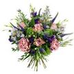 This hand-tied bouquet reads like a private view of a late-spring English meadow, carefully gathered and set against a clean white backdrop so every colour and texture is clear. At the centre, soft antique-pink roses unfurl in varying stages from tight buds to gently opened blooms, their petal edges a whisper of deeper rose-pink; nearby, two full-bodied carnations in a dusty mauve-pink add lush, ruffled volume that feels almost tactile. Vertical spikes of deep indigo to violet veronica push upward through the composition, giving it a lively architectural contrast, while sprays of tiny lavender-blue aster-like flowers with pale yellow eyes scatter like confetti, lending an airy, wildflower softness. Deeper purple lisianthus buds and small open blooms punctuate the palette with jewel tones, their cup-shaped forms balancing the softer pastels. The bouquet is grounded in an abundant mix of foliage - rounded, silvery eucalyptus leaves provide a cool, muted backdrop and slender green leaves and emerging buds give organic movement, while lime-green clusters of textural filler (resembling Santini or viburnum) nestle between blooms to brighten the whole. The stems are gathered and visible at the base, clearly hand-tied, the wrapping suggested only by the neat exposed cut stems. Bathed in soft, natural light that brings out the velvet of petals and the subtle fragrance of fresh green leaves, this arrangement radiates gentle celebration and quiet affection - the kind of bouquet you might send to lift someone's spirits or place on a kitchen table to bring a feeling of perennial spring to a Grove Park home near Chinbrook Meadows.