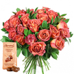 This visually striking gift set offers a vivid symphony of colours and textures, expertly arranged for Grove Park's discerning flower lovers. At its center, a generous bouquet of roses glows with a warm palette-soft yellow-cream at the heart, deepening outward into peach, coral, salmon, and glowing rose pinks. The clustered blooms alternate between tightly furled buds and full, open blossoms, their velvet petals and subtle bicolor gradients catching every shift of light. Interwoven, dark green foliage supplies both structure and freshness, echoing the leafy abundance of Grove Park's neighbourhood streets. To the lower left, a Thorntons Orange Crisp packet stands upright, elegantly branded and described as a Tangy orange flavoured truffle with crispy wafer, coated in milk chocolate. Placed invitingly in front, two real truffles rest, their glossy surfaces promising an indulgent bite. Together, flowers and chocolates form a harmonious whole, perfect for making a birthday memorable in Chiswick or celebrating Mother's Day on Grove Park Terrace. The image resonates with comfort, celebration, and connection-a testament to the expertise, attention, and local heart that Grove Park Florist brings to every special occasion.